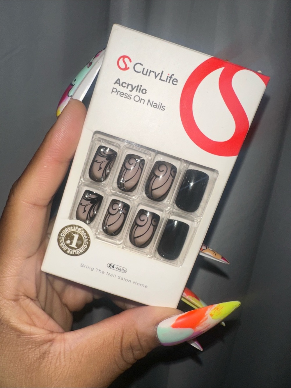 Acrylic Press-On Nails in Nude and Black with Swirl Accent